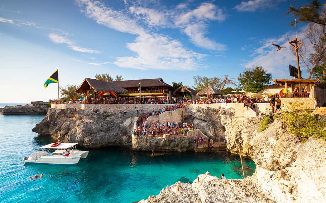 From Montego Bay: Negril Beach & Rick's Cafe Sunset Day Trip - Margaritaville-style beach stop: food, drinks, and entertainment access